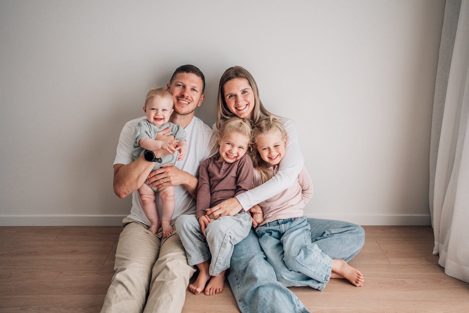 Relaxed family of five during a studio session at The Little White Studio