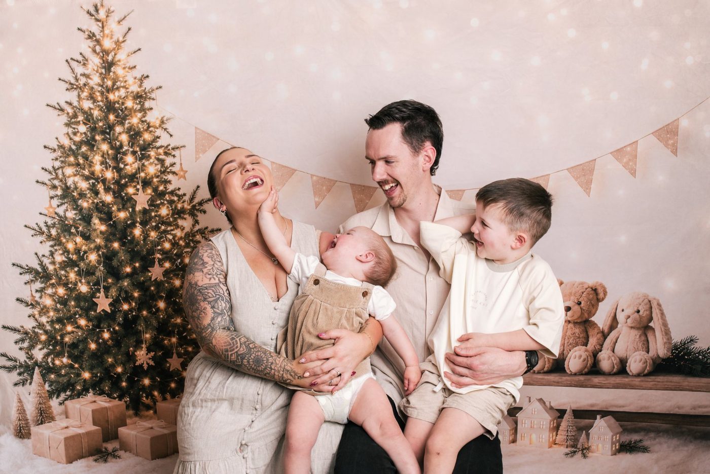 A family laughing together on the Christmas set