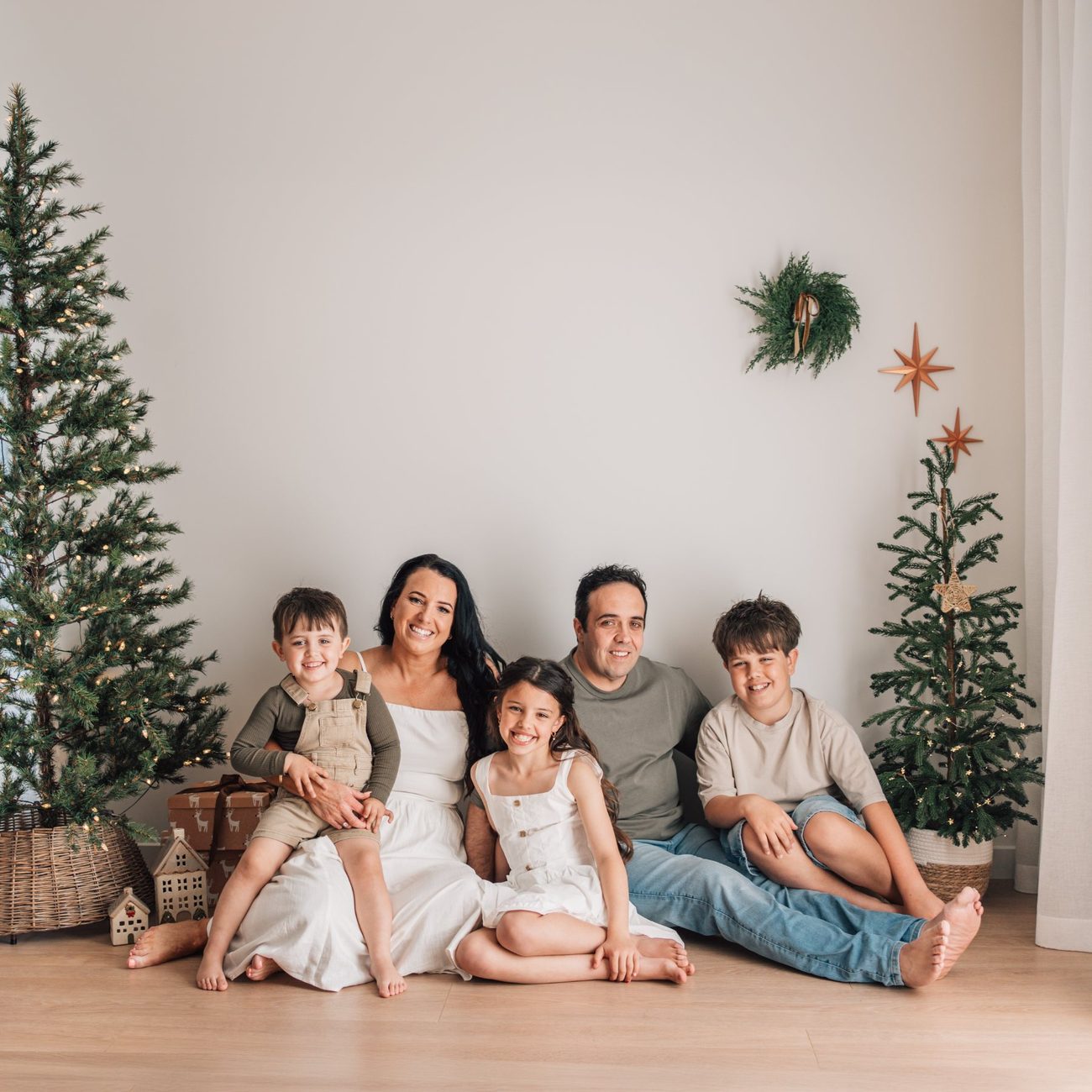 A family portrait from a Christmas Story session at The Little White Studio