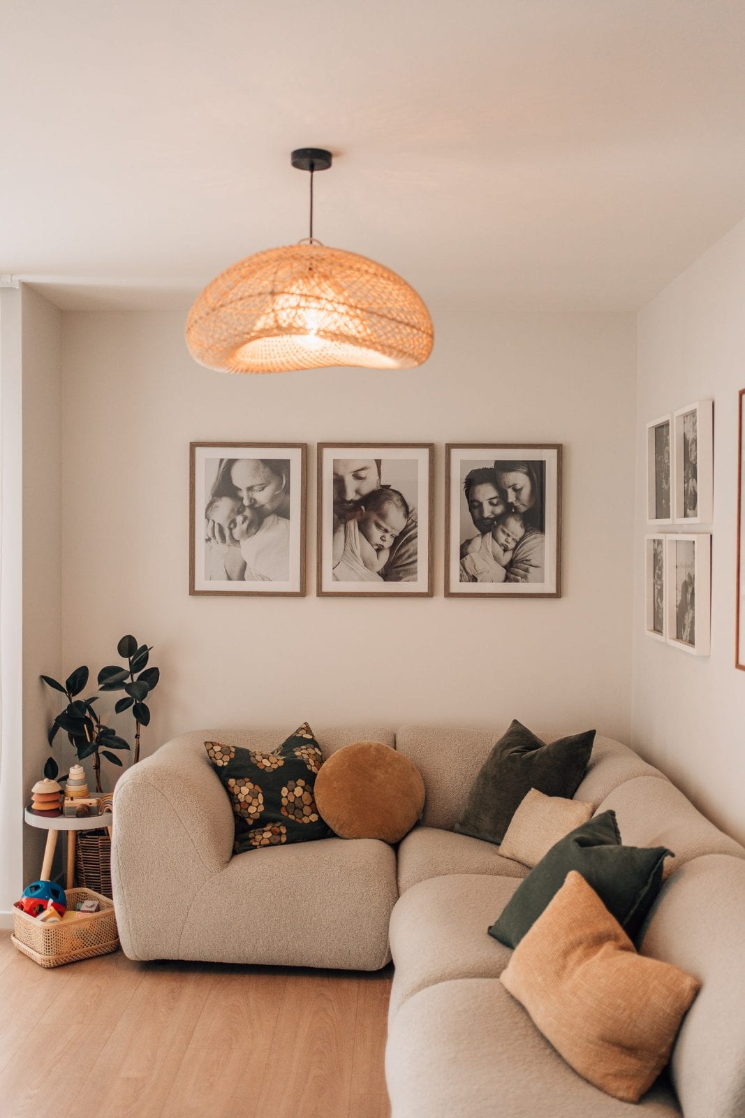 Portrait view of the boucle lounge and newborn gallery wall inside our Lincoln, Canterbury family portrait studio.
