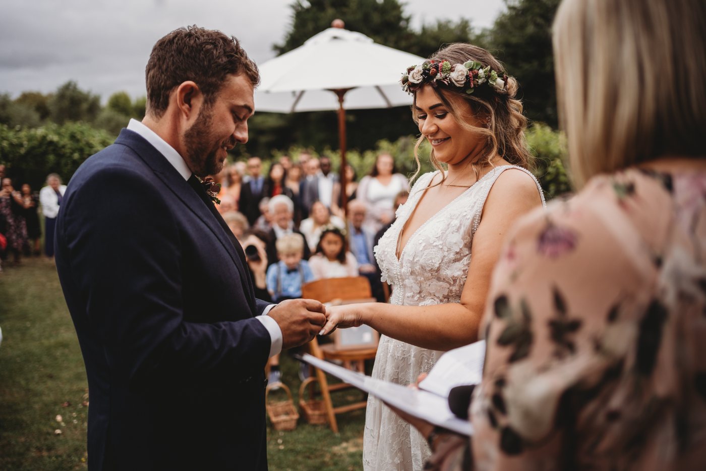 A couple exchanging rings during their ceremony